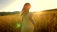 istock MS TS SLO MO Girl Running In Field At Sunset 509755969