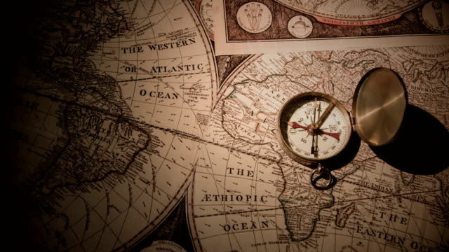 Golden Compass On Antique Map