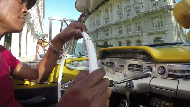 Havana taxi historic downtown old city mixed race tourist journey