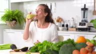 istock Healthy young woman drinking juice 1024674944