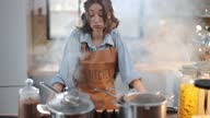 istock Housewife in a smoky kitchen from burnt food 1299896964
