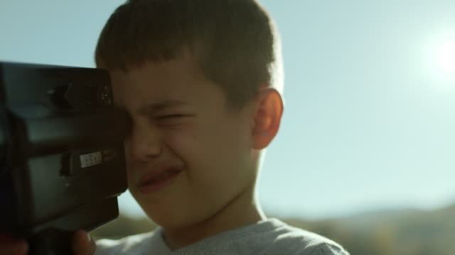 Little boy capturing the moment with his camera