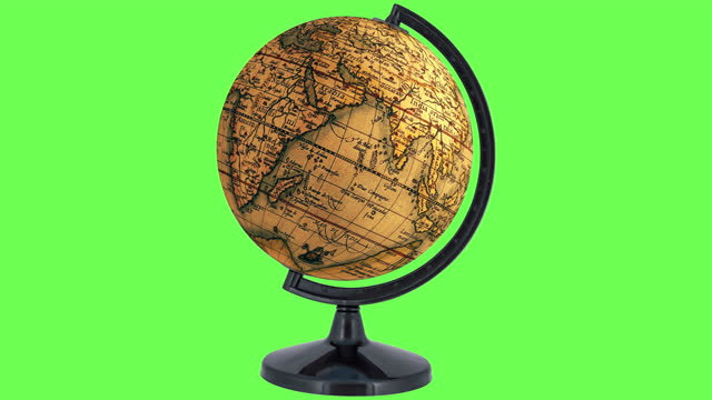 Looping antique globe spins continuously on green screen