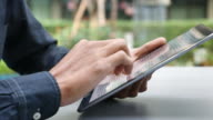 istock Man Reading text on Digital tablet 1156964499