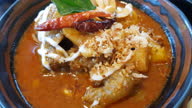 istock Massaman curry in a frying pan with spices on the cement floor, Thai food 1331205931