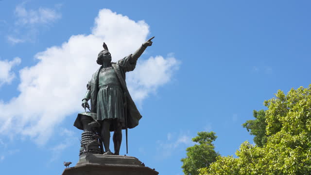 Monument to Christopher Columbus against a blue sky in Colonial City