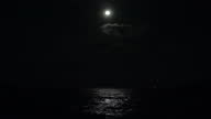 istock Moon over the sea with moonlight reflections on the water. 1372560901