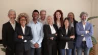 istock Multiracial generational bank office: Successful business team smiling on camera 1393276859