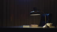 istock Mystical night scene of a lamp on a desk 1297325737
