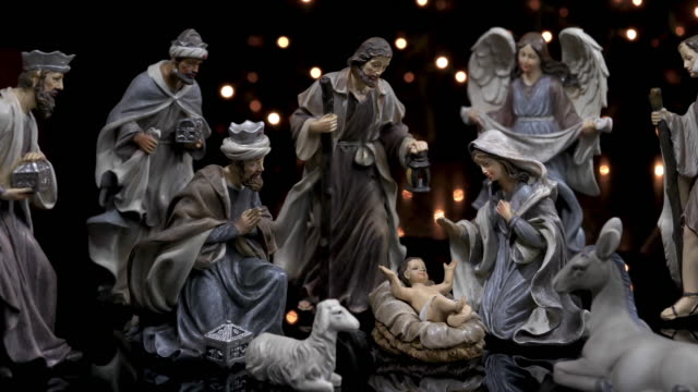 Nativity figures scene Christmas manger with lights