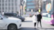 istock out of focus pedestrians cross the road via crosswalk and cars wait on traffic lights 1427437793