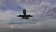 istock Passenger airplane before landing over sea 1288154819