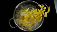 istock Penne pasta splashing into boiling pot - Top Shot 696880044