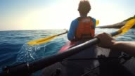 istock POV Person paddling in a tandem sea kayak on a sunny day 1141389595