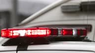 istock Police car emergency red lights are flashing 1354348032