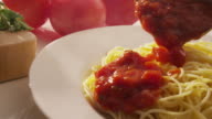 istock Pouring marinara sauce onto spaghetti 135931249