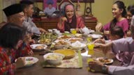 istock ramadan hari raya malaysian muslim multi generation family enjoying dinner at home in dining room 1311318821