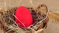 istock Red Easter Egg Nested in Basket 1377743063