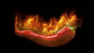 istock Red hot chili pepper on fire on a black background. 1389839317