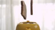 istock Roasted toast bread popping up from toaster,Slow motion 1215304550
