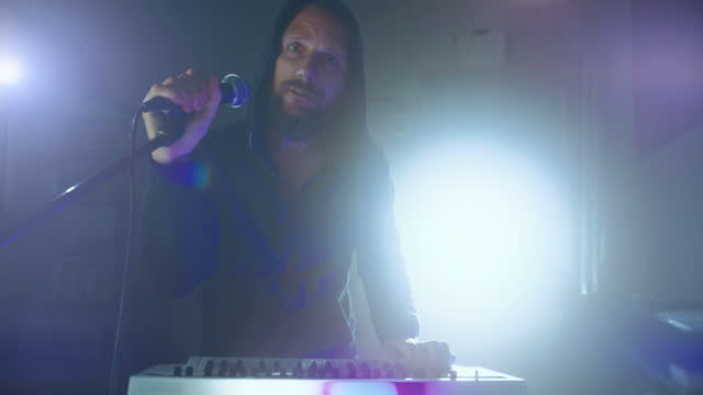 Rock keyboard player in a live show with stage lights