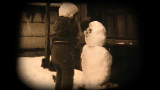 60's 8mm footage - playing with a snowman