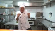 istock Senior chef dancing at kitchen 1195099250