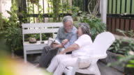 istock Senior couple travel on urban street. 1413754327