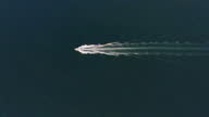 istock Ships wake, top view. Aerial drone shot over the boat. Foam trail with waves 1403937605