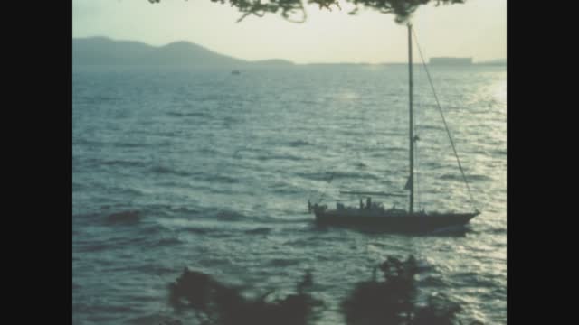 Spain 1988, Sailboat on blue sea in 80s