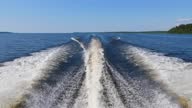 istock Speedboat rush at freshwater bay or lake, look back to white wake 1373650087