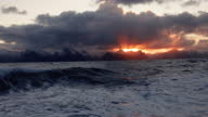 istock Sunset on a rough sea, with waves of the open ocean from a boat 1354770706