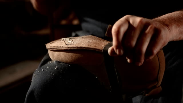 HD Super Slow-Mo: Shoemaker Fastening The Outsole