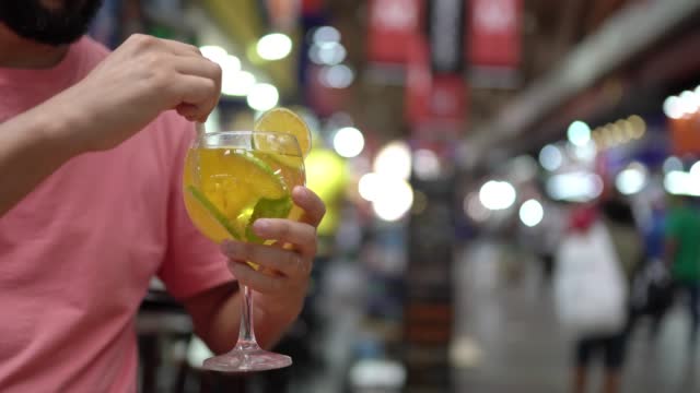 Tourist drinking at the Municipal Market of São Paulo