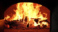 istock Traditional brick oven with fire 1296519912