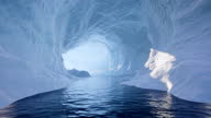 istock Traveling slowly through an ice cave and exiting the other side onto a beautiful ocean scene 1300340943