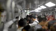 istock Unrecognizable Adult asian people riding in subway car of Hong Kong airport 1341254288