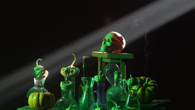 4K Video Of Human Skull Pumpkin Poison Bottle In Dark For Halloween