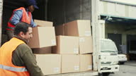 istock Warehouseman and Truck Driver Loading Vehicle 1341624905
