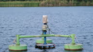 istock water cleaning machine in the big pond for purify water 1400732607