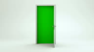 istock White Door Opening to Green Screen - Empty Room | 4K 1160805877