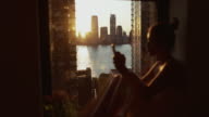 istock Woman by the window in New York 1168766901