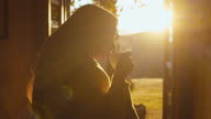 istock SLO MO Woman having a cup of coffee on the backyard of her holiday villa at the Tuscany 1314095760