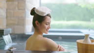 istock woman relax in hot spring 1350073780