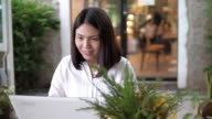 istock Woman working and using with laptop at cafe , SLOW MOTION 1204354190